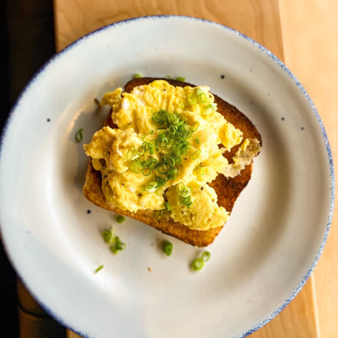 Showing off one of our eggs-quisite brunch items of cheesy farm eggs with chives, toast, and cheese curds. The perfect breakfast combination to start your day on a bright side! Come in during our brunch hours of 11 am - 5 pm every Sunday!

#eggs #bri