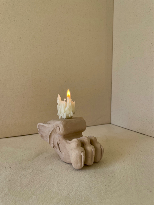 'Brown Eyes', recycled clay, candle end, 2025.