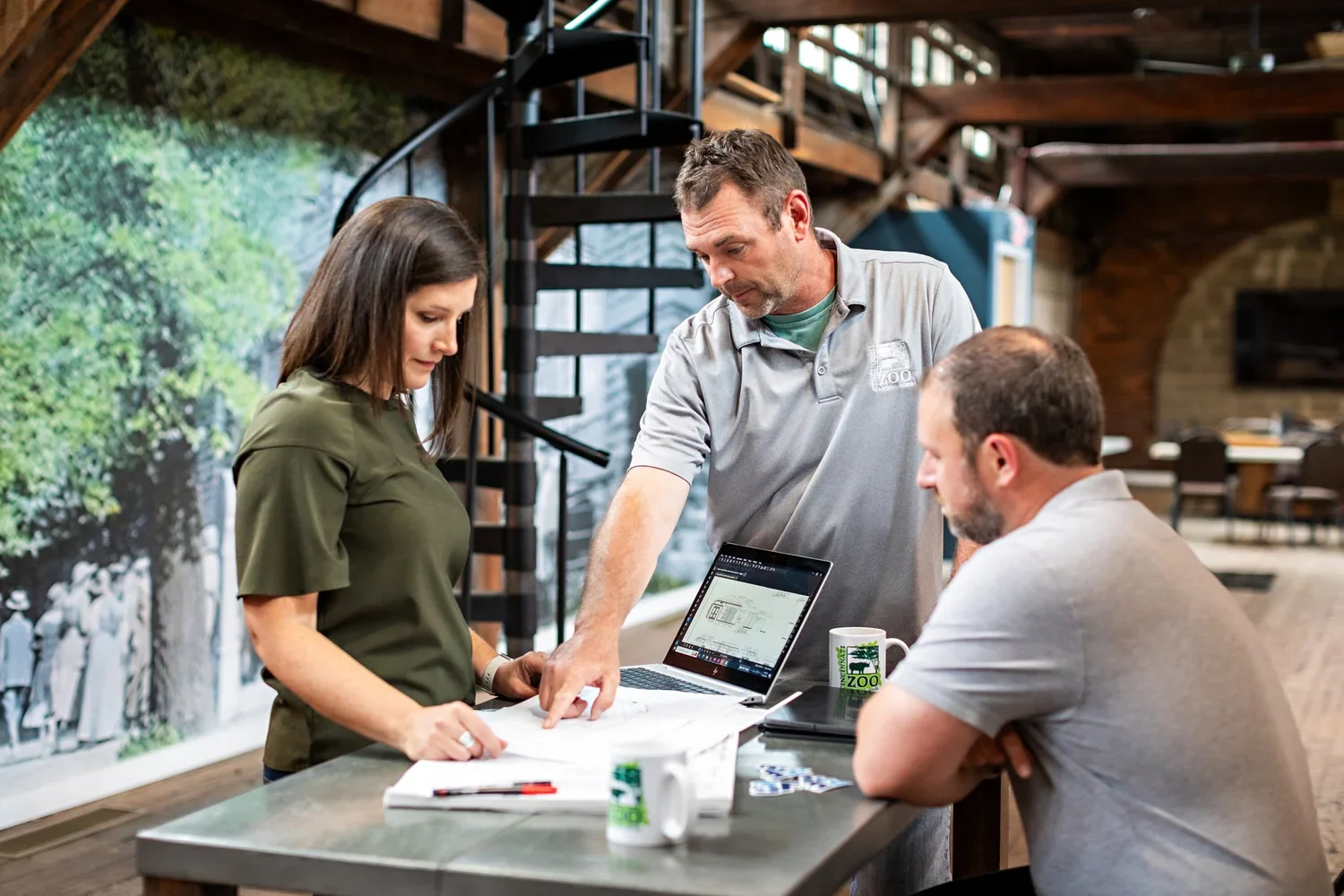 Amy and Dominic review plans with the Cincinnati Zoo.
