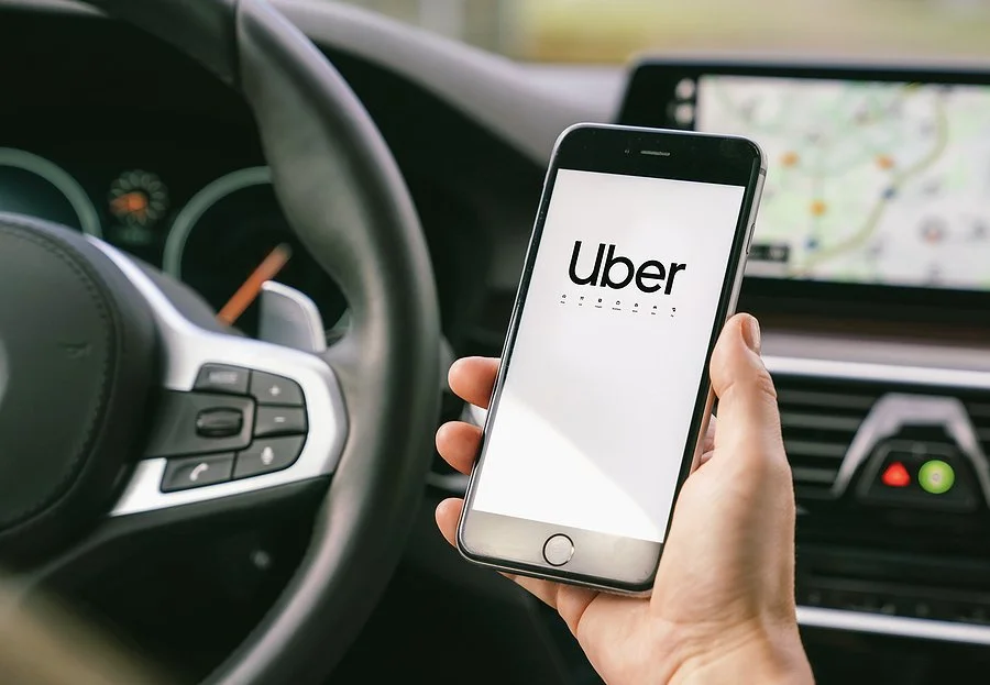 bigstock-Uber-Driver-Holding-Smartphone-345479947.jpeg