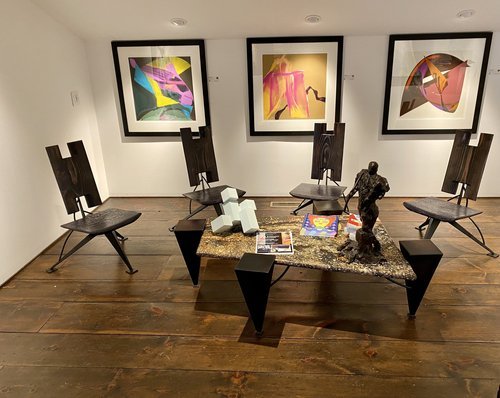  SUITE OF FOUR CHAIRS AND COFFEE TABLE; WOOD, STEEL, AND GRANITE 