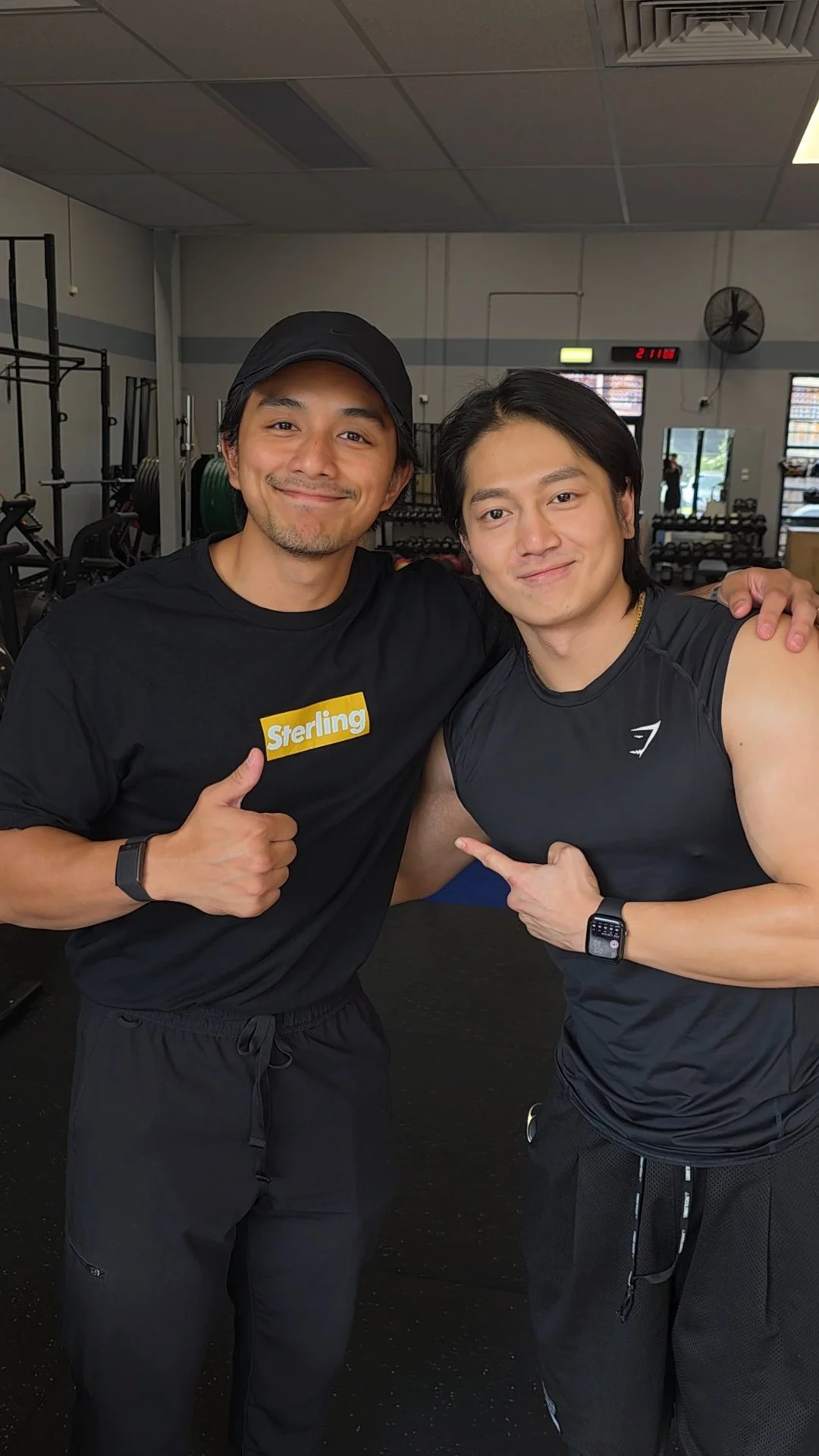 Physio Andrue Sacris and bodybuilding client, Oscar