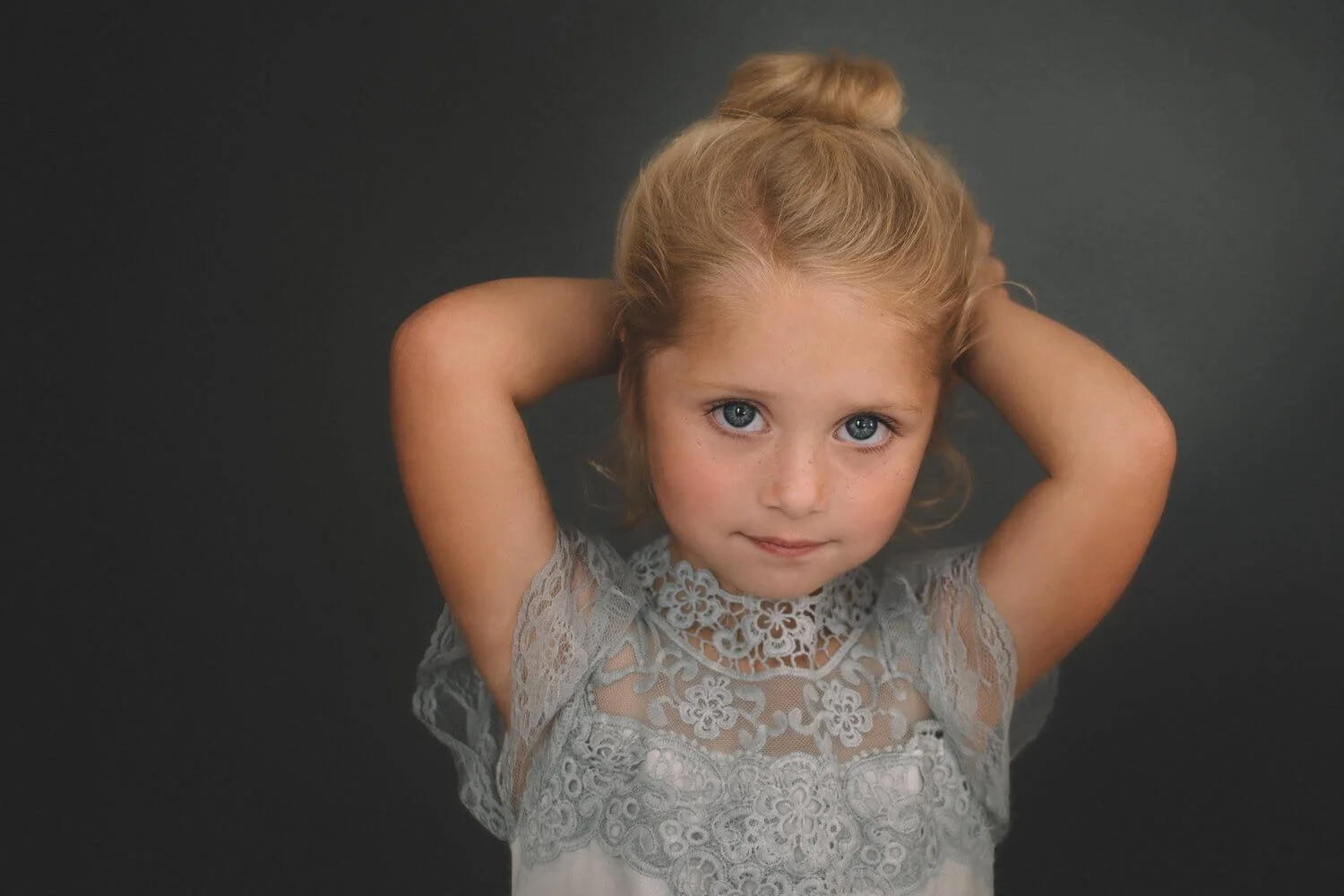 Fine art studio portrait of a young girl in a lace dress by Depiction Portraits in Woodstock, Virgina