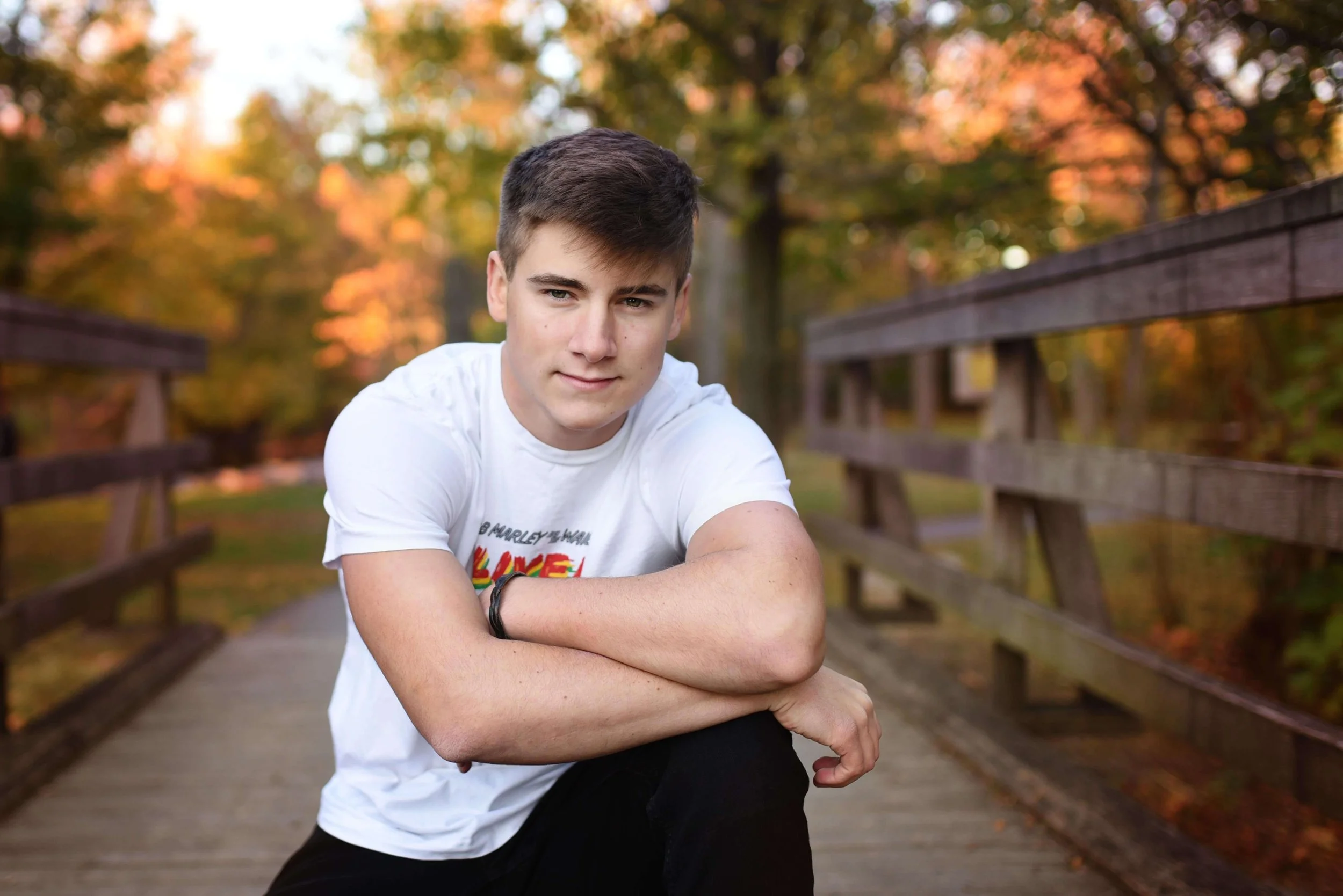 Guy poses for senior pictures.jpg