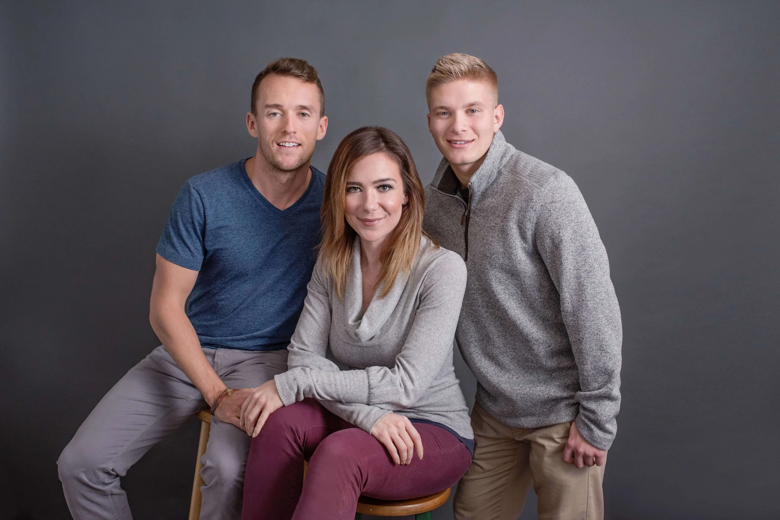 Siblings posed together for a family portrait in Woodstock, Virginia studio by Depiction Portraits