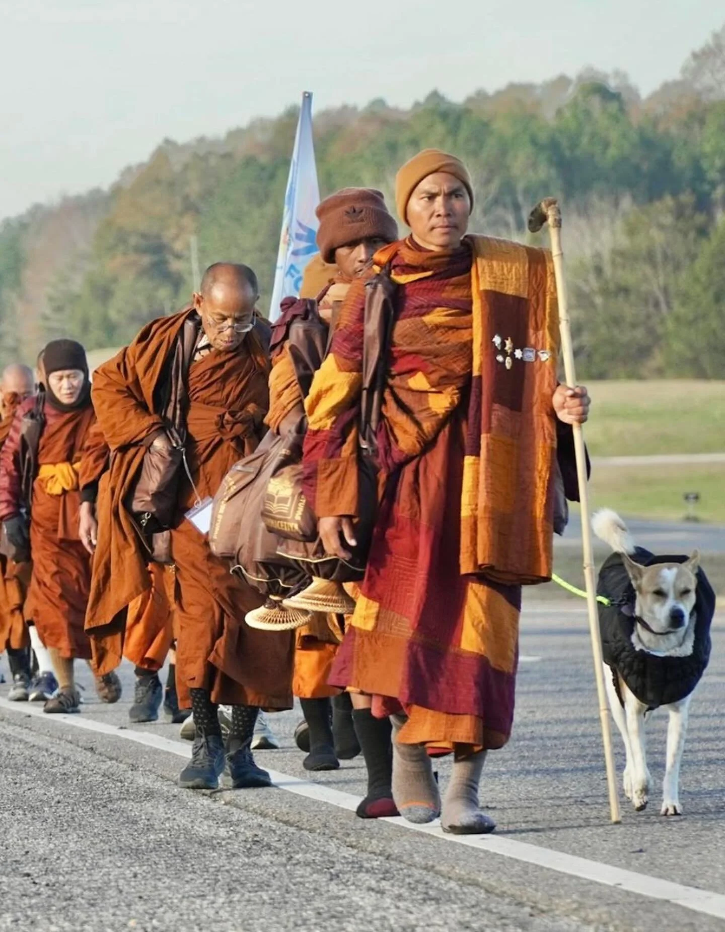 Monks walking for peace w/ their peace dog, Aloka. Their journey began in Fort Worth, TX and will end in Washington DC. They are currently somewhere in Alabama.

 May we all find PEACE ☮️