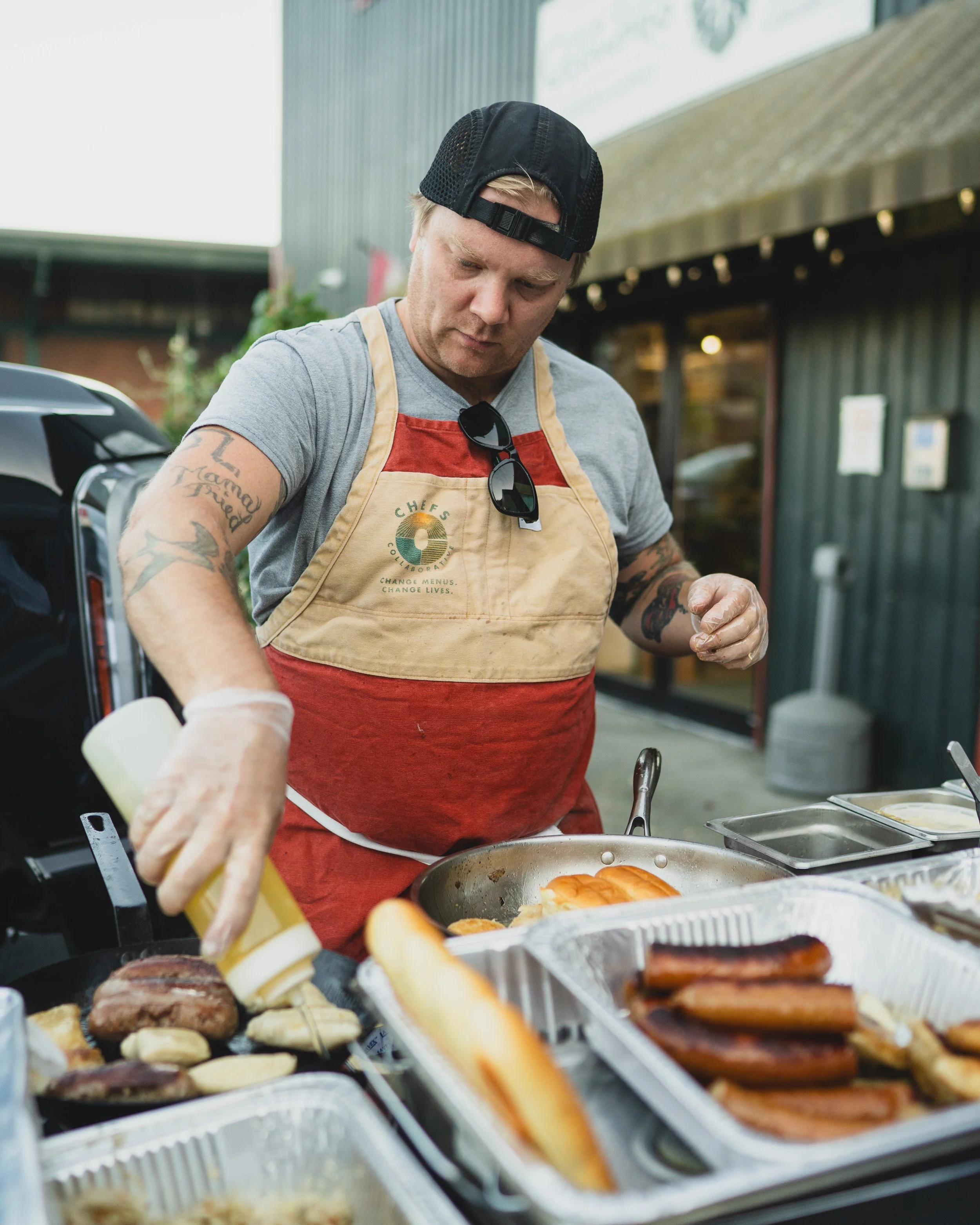Tim Shulga shucking oysters at a private wedding