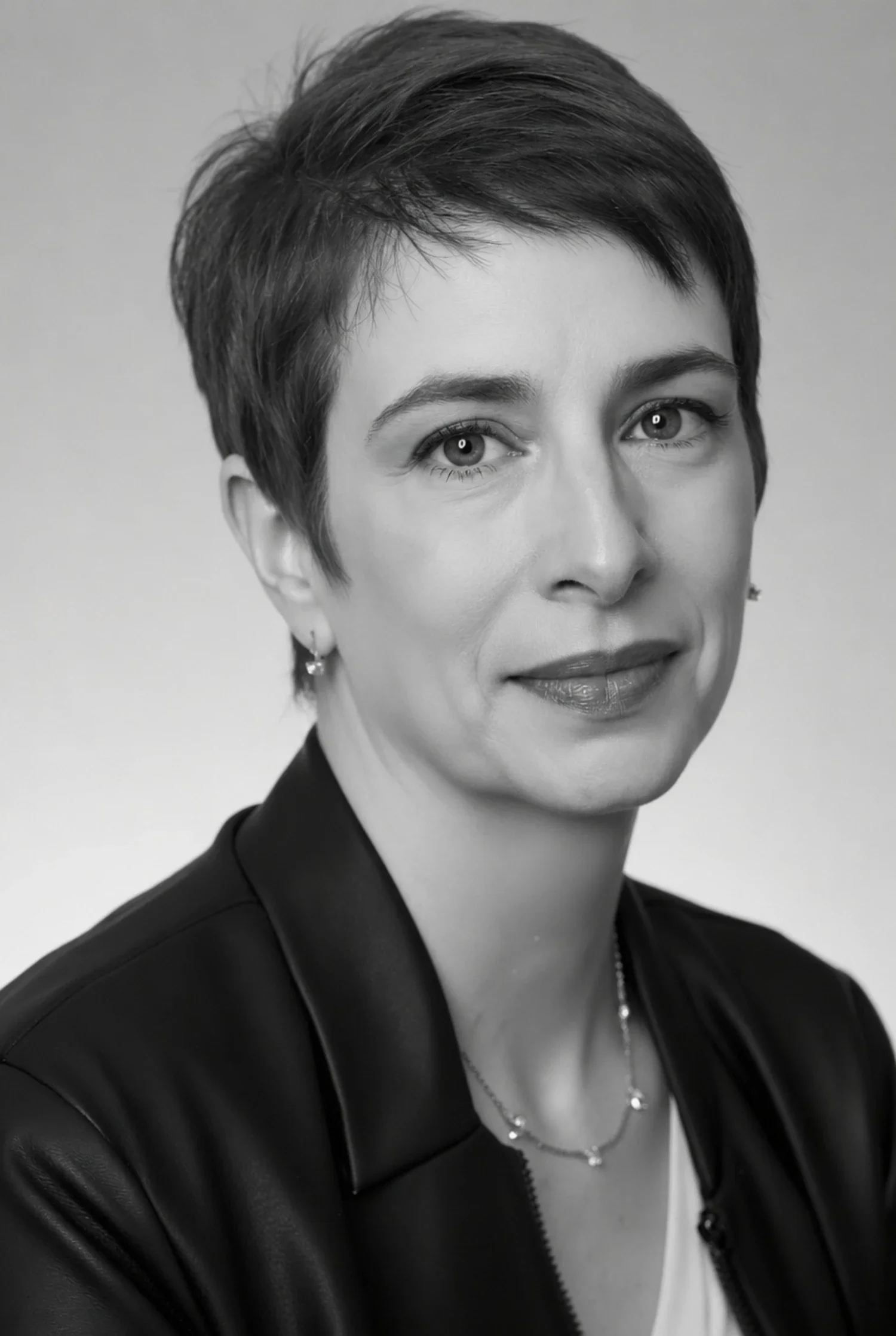 A black and white headshot of Meg Desjarlais, Founder of Purpose & Pixel and web design and branding studio