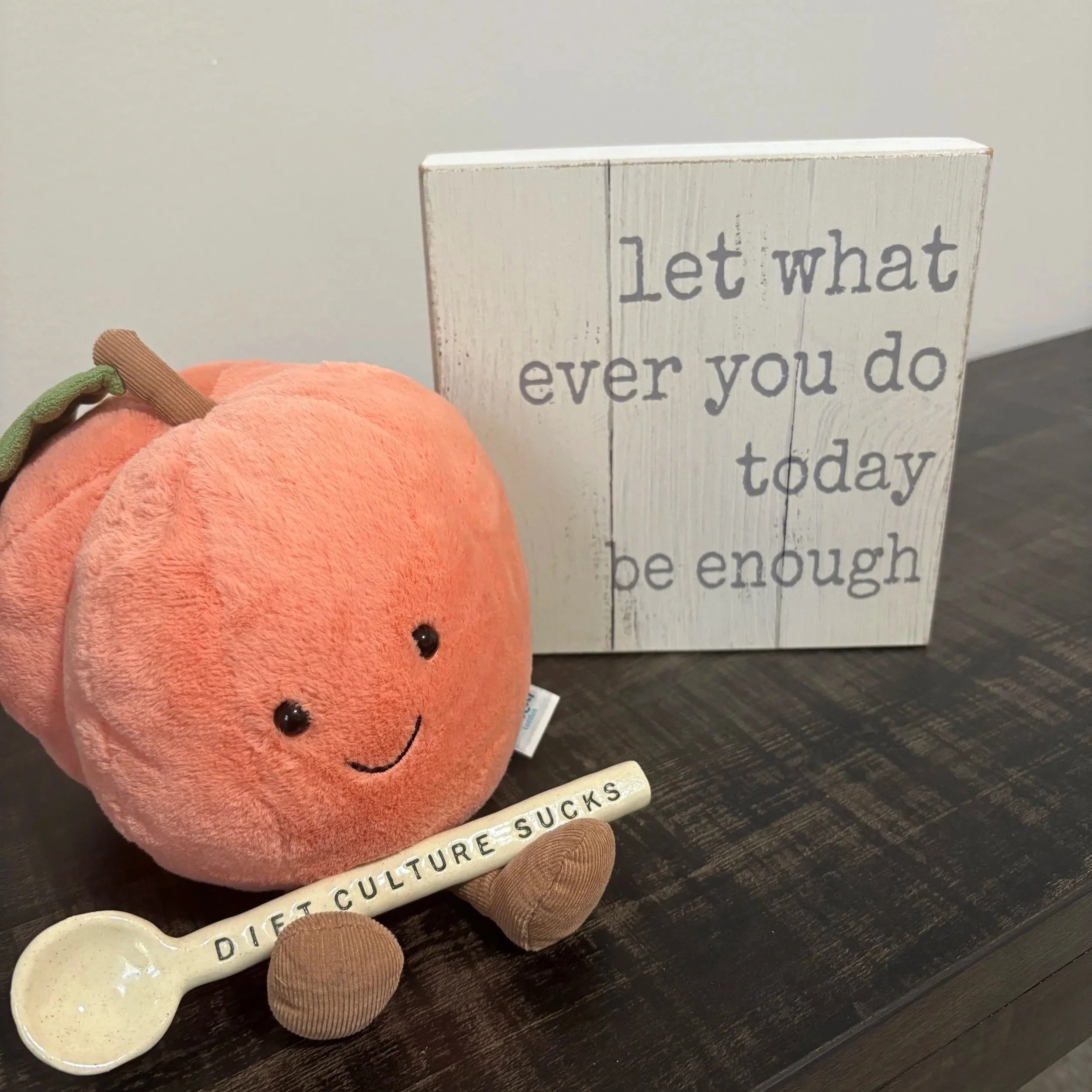 Graphic of a peach with the words "diet culture sucks"