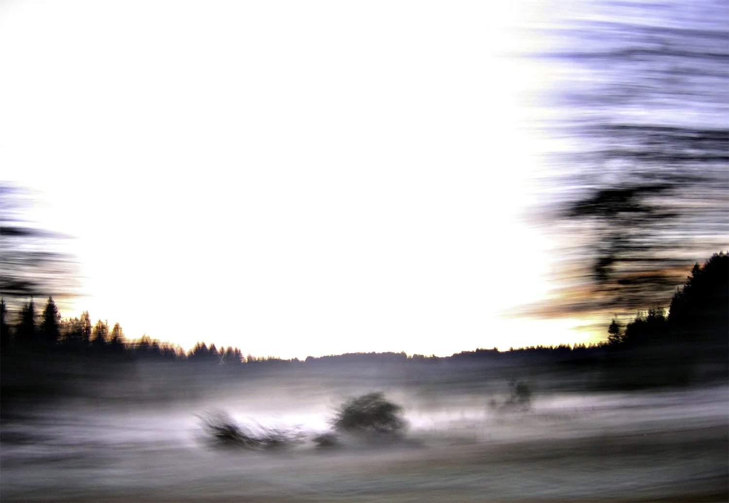 Motion landscape photo during a foggy sunrise.