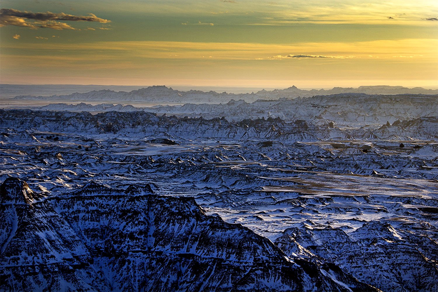 Snow covered sunset in Badlands National Park South Dakota.