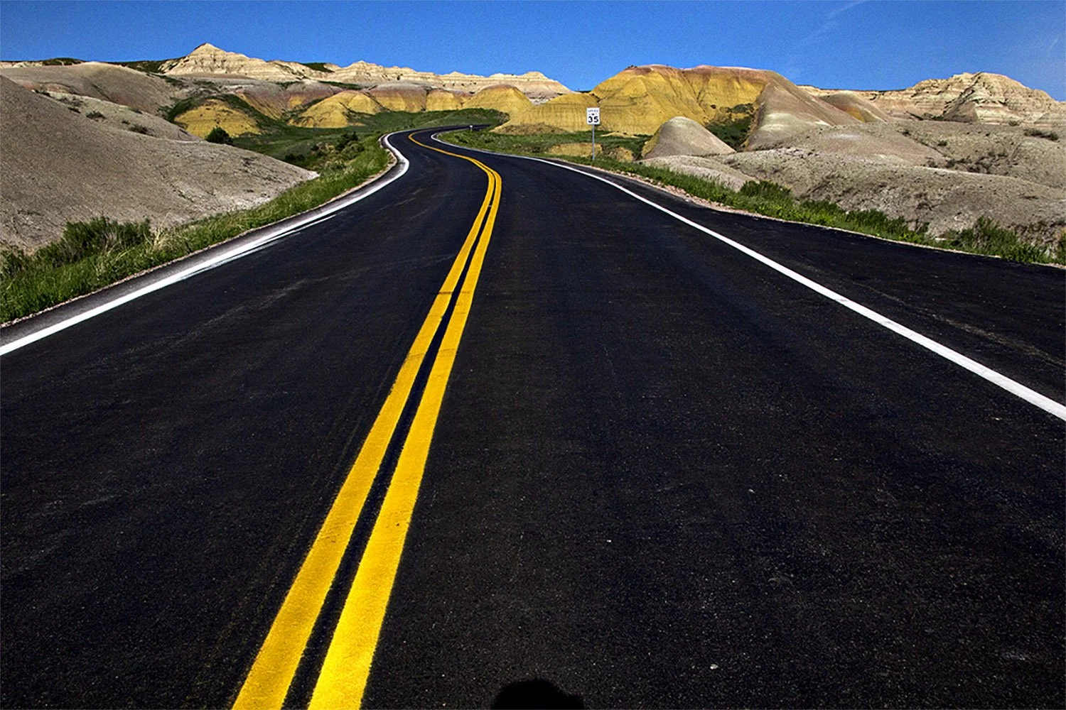 View of an open road in Badlands National Park South Dakota.