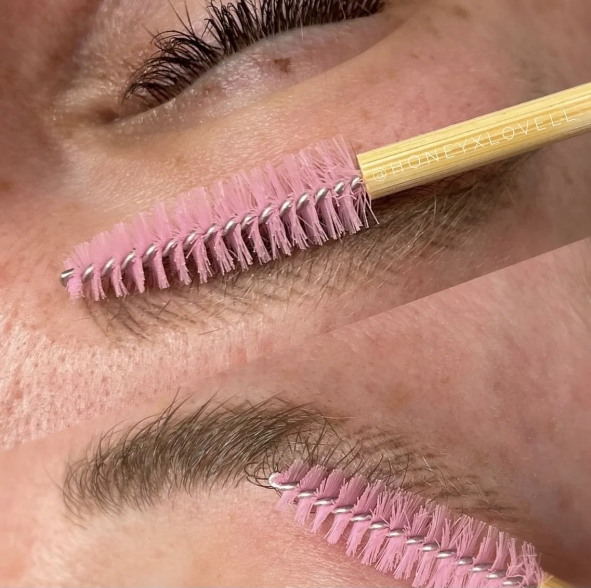 Close-up of a person's closed eye with a pink eyelash brush resting on the eyelid.