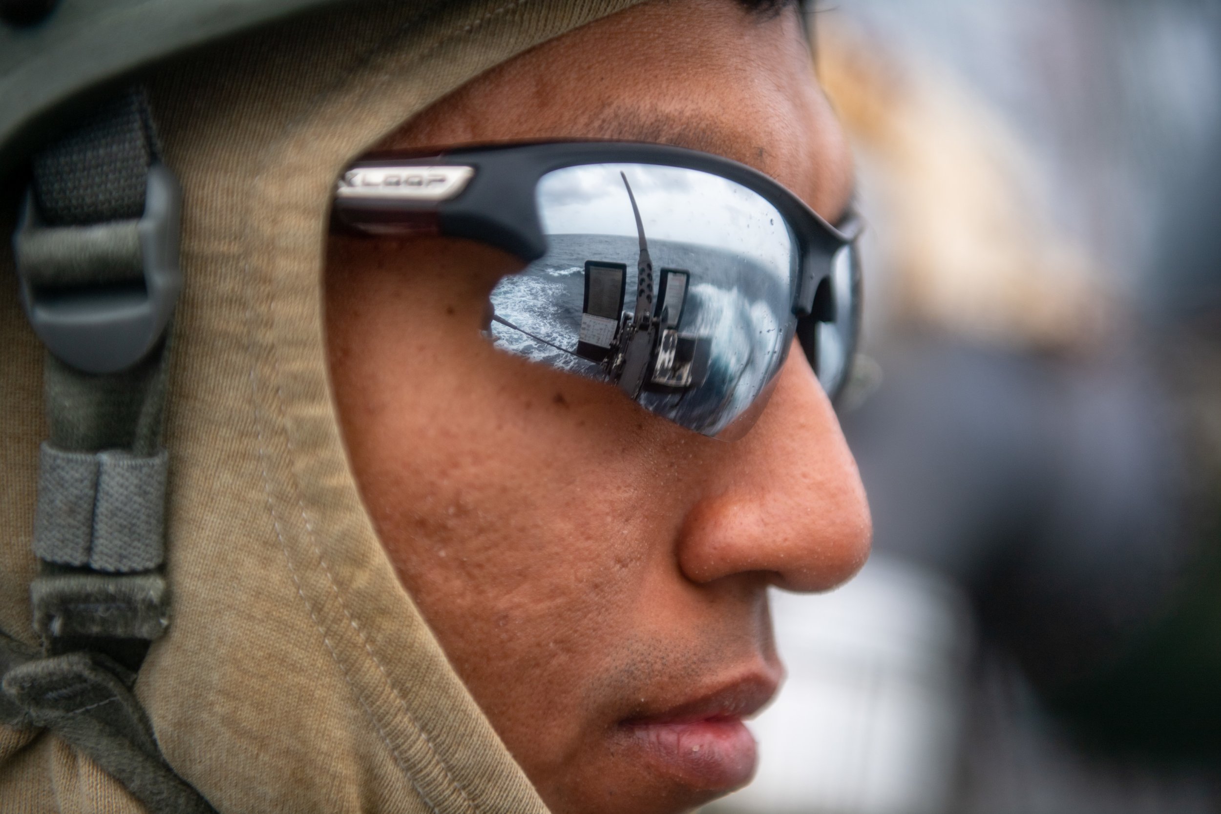  SOUTH CHINA SEA (Aug. 30, 2021) Retail Specialist 3rd Class Russell Sevilla, from San Diego, prepares to fire a .50 caliber machine gun during a crew serve weapons familiarization training aboard Arleigh Burke-class guided-missile destroyer USS O’Ka