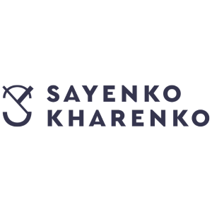 Logo of Sayenko Kharenko law firm with a sailboat graphic and company name below.