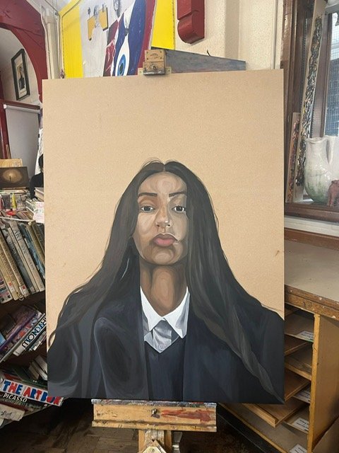 The large scaled oil painting is of myself. It took around 19 and a half hours to be completed. Showing a powerful, yet patronising look and representing a Punjabi girl. Challenging gender roles in the community, hence I’m in a suit (which is typical