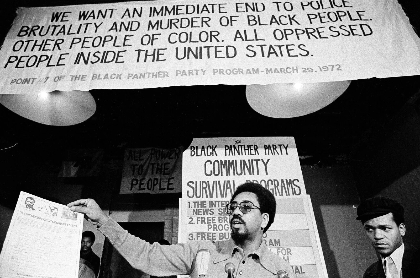 Bobby Rush holds The Oppressed People's Commitment petition at 4233 S. Indiana, Photographer Fred Stein, October 26, 1972, ST-19030979-0007, Chicago Sun-Times collection, Chicago History Museum
