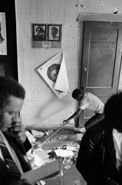 A boy helps clean the office after another police raid on July 30, 1969. Photographer Perry C. Riddle, ST-19030968-0011, Chicago Sun-Times collection, Chicago History Museum