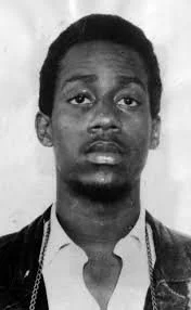 Mugshot of FBI informant and provocateur William O'Neal. During his time in the Panther Party, O'Neal committed numerous crimes and schemes to entrap Panthers into arrests and prison, and ultimately conspired in the assassination of the Illinois Depu