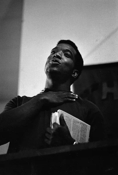 August 1969. Fred Hampton, recently released from Menard prison on an appeal bond, officiates the Panther wedding of Chaka Walls and Wanda Ross at Trinity Lutheran Church, 4837 S. State Street in Chicago. Photographer Paul Sequeira had unprecedented 