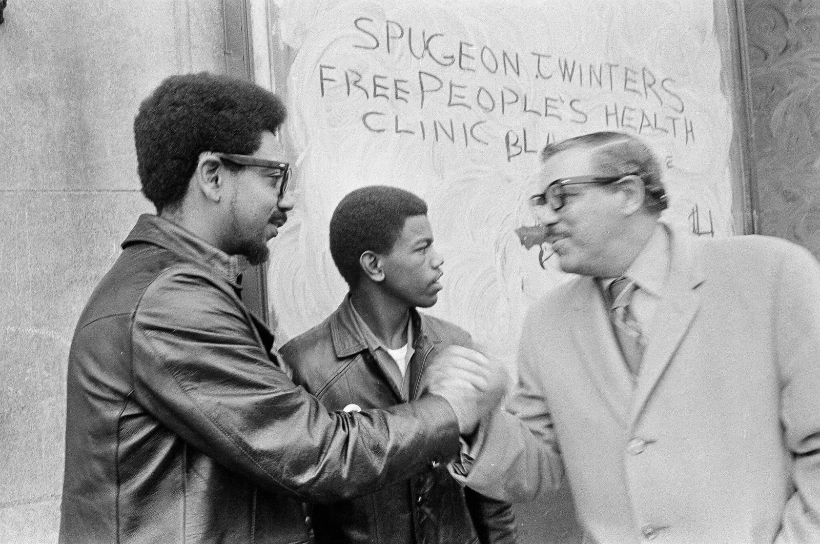 (l-r) Deputy Minister of Defense Bobby Rush, Clinic Coordinator Ralph Bostick, Alderman Sammy Raynor on December 25, 1969, at the Dedication. Photographer Larry Graff, ST-19030952-0004, Chicago Sun-Times collection, Chicago History Museum