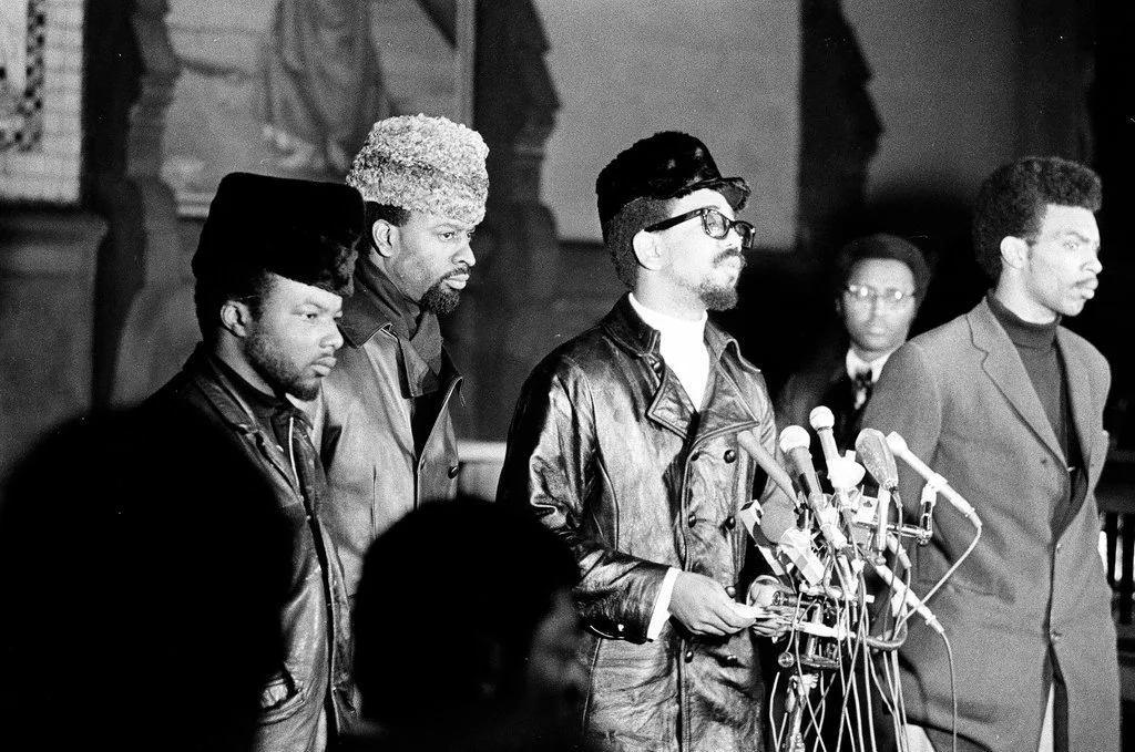 Press Conference at the People's Church,  December 11, 1969. A week after Deputy Chairman Fred Hampton and Defense Captain Mark Clark were killed in a pre-planned assassination, Deputy Minister of Defense Bobby Rush led a press conference to dispute 