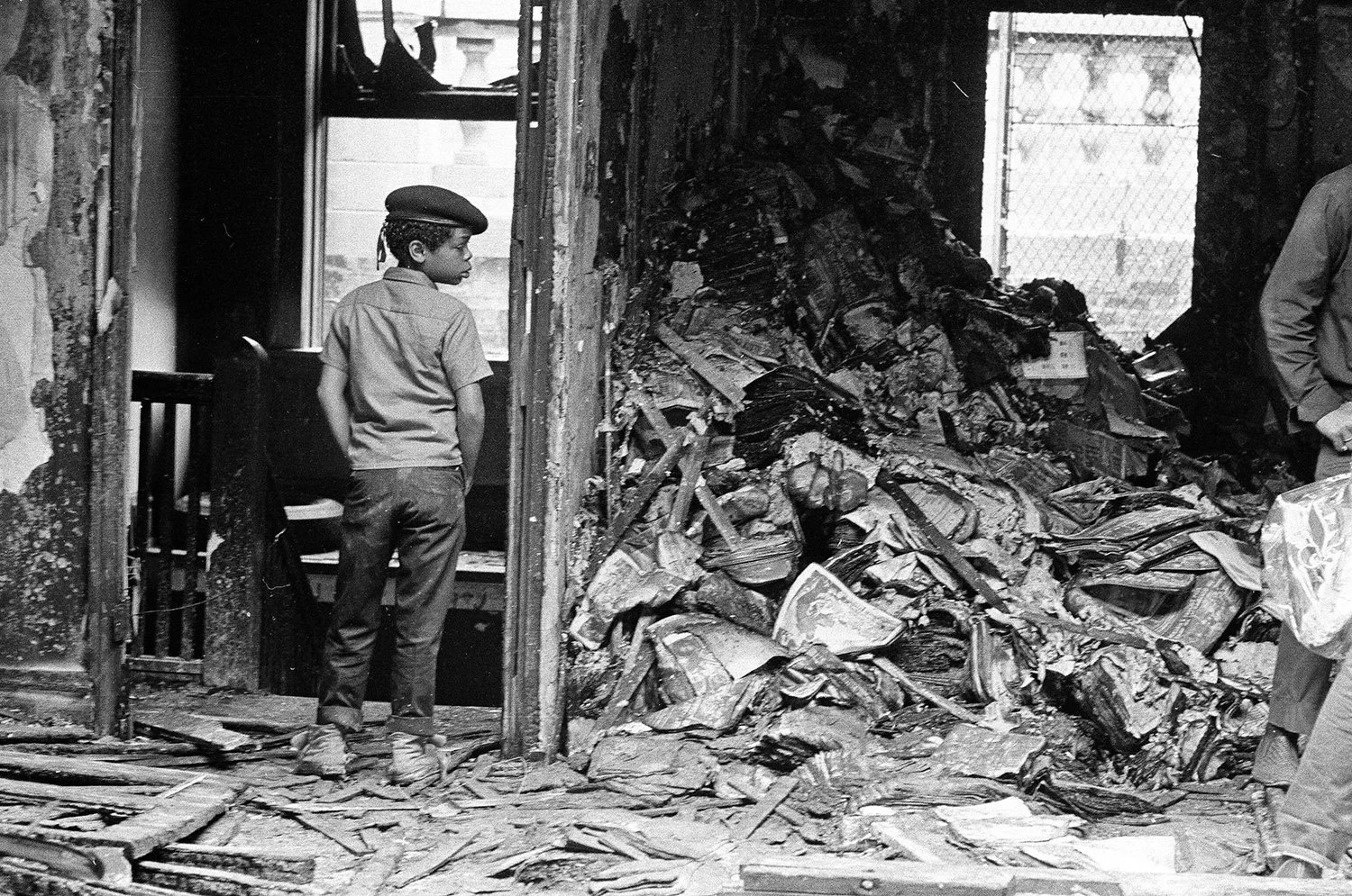 A member of the Junior Panthers overlooks the damage done by police during the raid on July 30, 1969. Photographer Perry C. Riddle, ST-19030968-0080, Chicago Sun-Times collection, Chicago History Museum