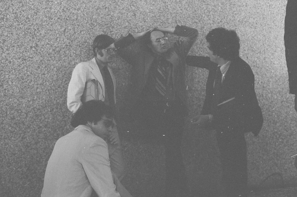 June 20, 1977. Panther lawyers (l-r) Mike Deutsch, Flint Taylor, Dennis Cunningham and Jeffrey Haas at U.S. District Court in Chicago after seven police officers were found not guilty of murdering Fred Hampton and Mark Clark. Photographer Jim Frost, 