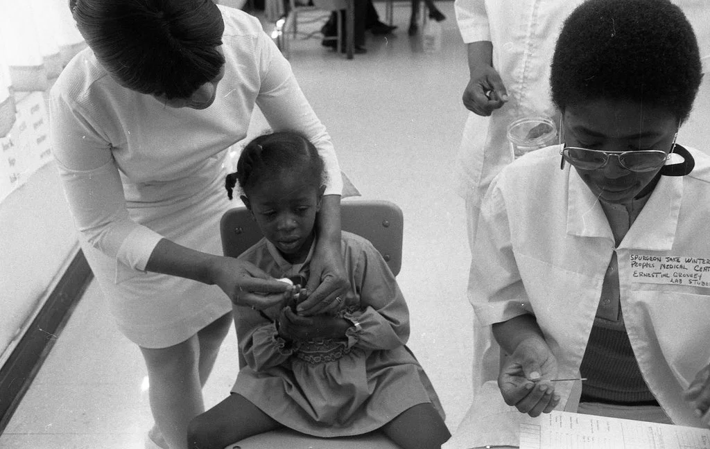Panther Ernestine Crossley, Co-Coordinator of the clinic, was a lab student being trained to do screenings with Nurse Lois Webb at Penn Elementary. May 12, 1971, Photographer Duane Hall, ST-17100001-0023, Chicago Sun-Times collection, Chicago History