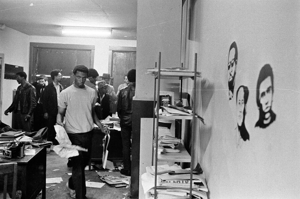 Fred Hampton's brother, Bill Hampton, helps clean after the raid on June 4, 1969. In the background are Jewel Cook, Skip Andrew, Bobby Rush and others. ST-19031008-0001, Chicago Sun-Times collection, Chicago History Museum