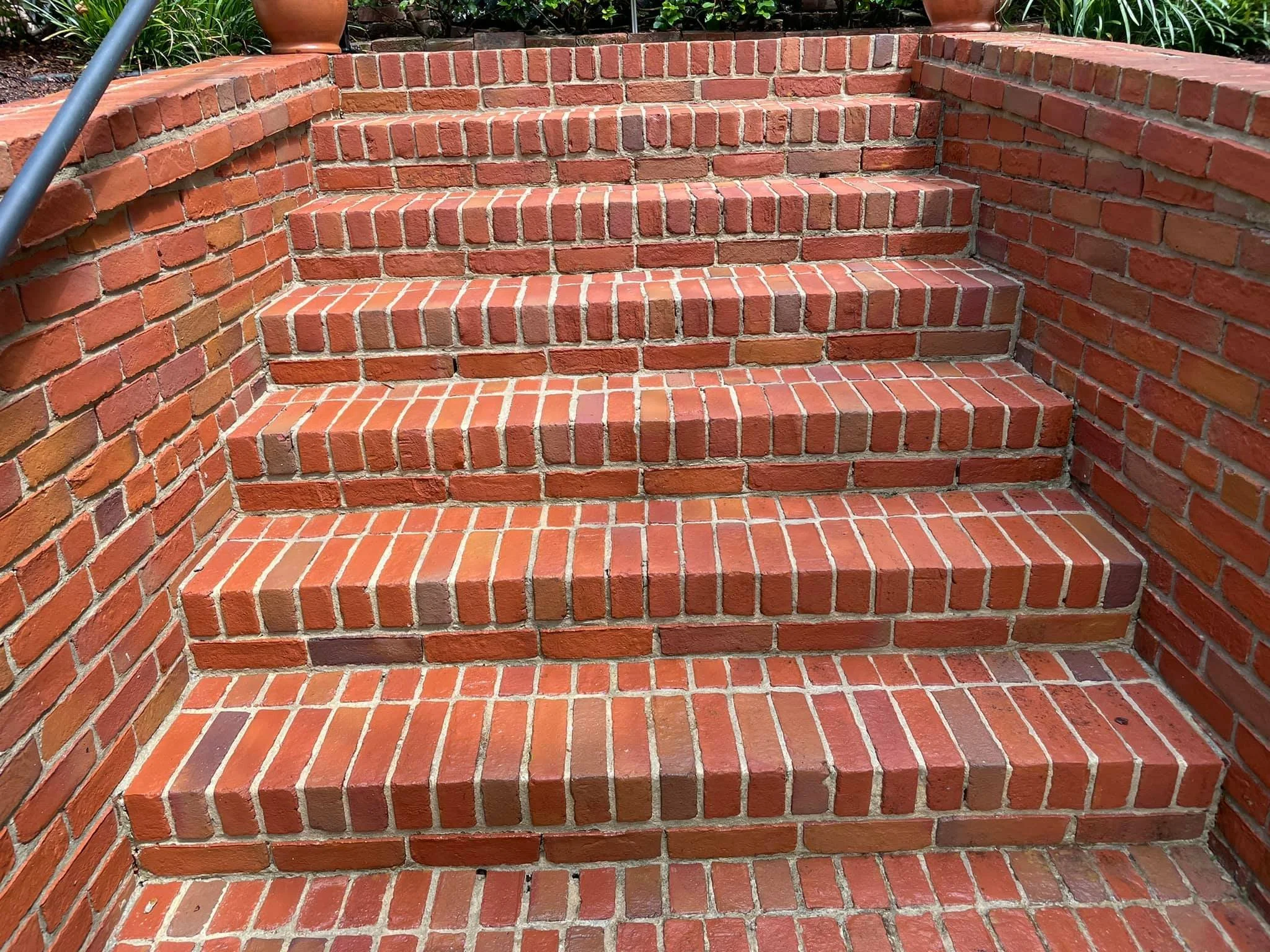 Cleaning brick steps in downtown Natchez