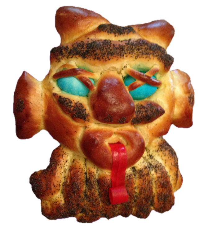 Eyes of Haman, or Ojo De Haman challah, with blue eggs for eyes and a red fruit roll up for a tongue, baked