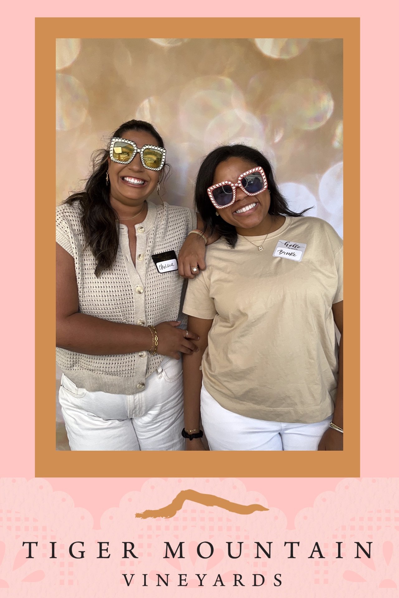 event planners smile in photo booth