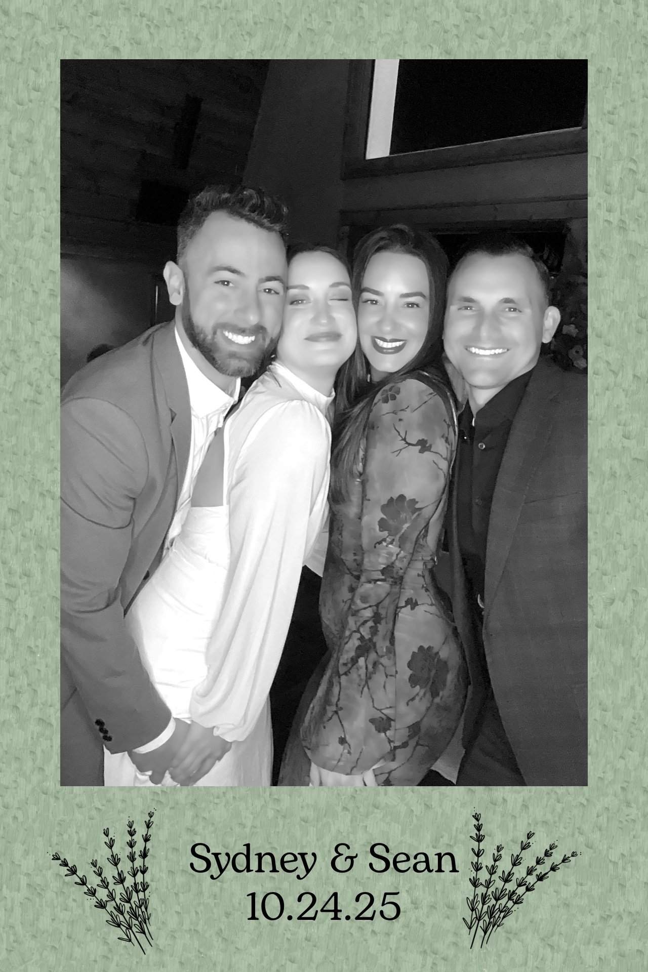 Guests laughing in wedding photo booth