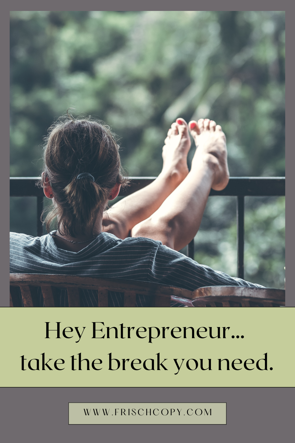 A woman is sitting on a chair outside, her feet resting on the railing in front of her. There is a table next to her with a drink.