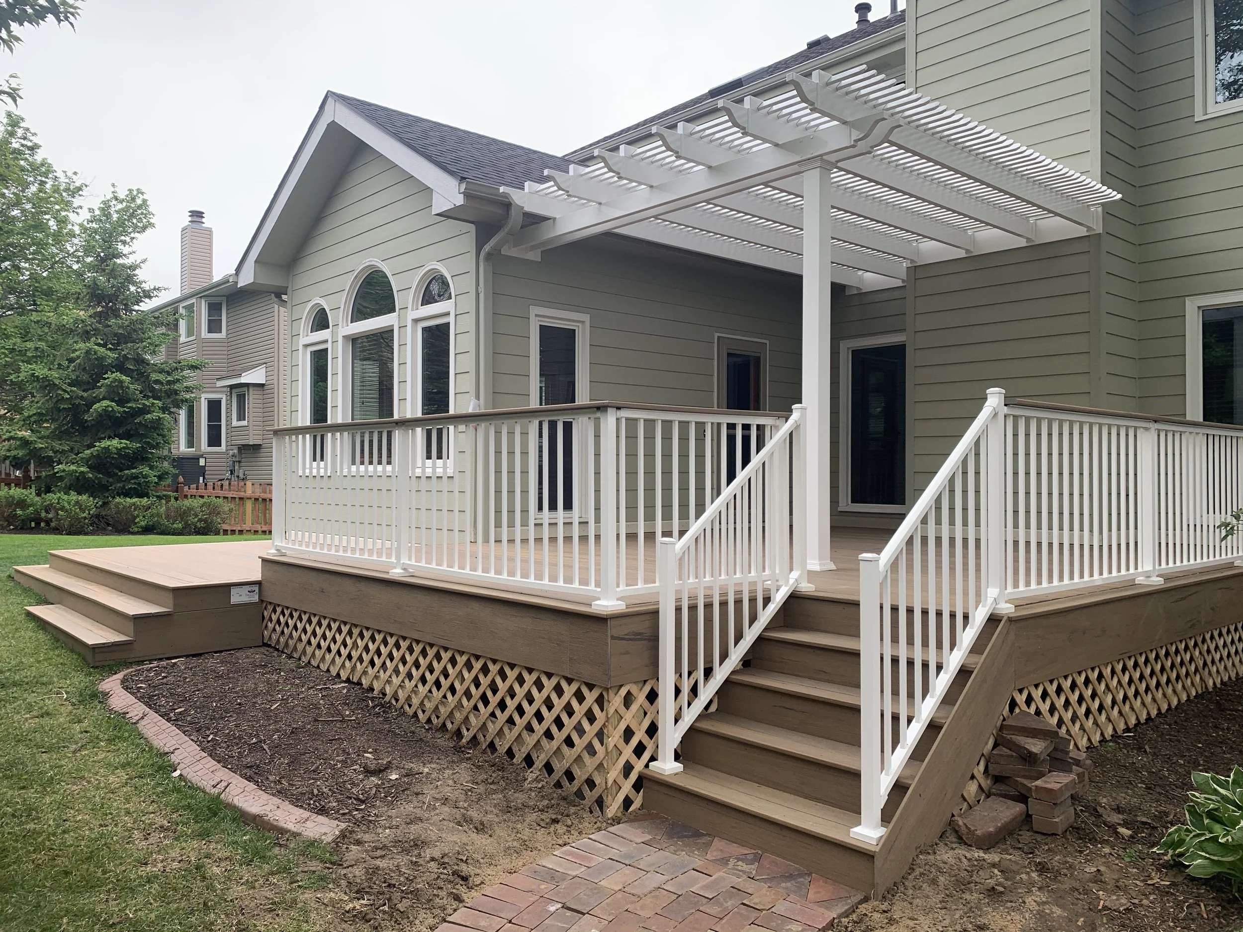 Low maintenance pergola and timbertech deck.