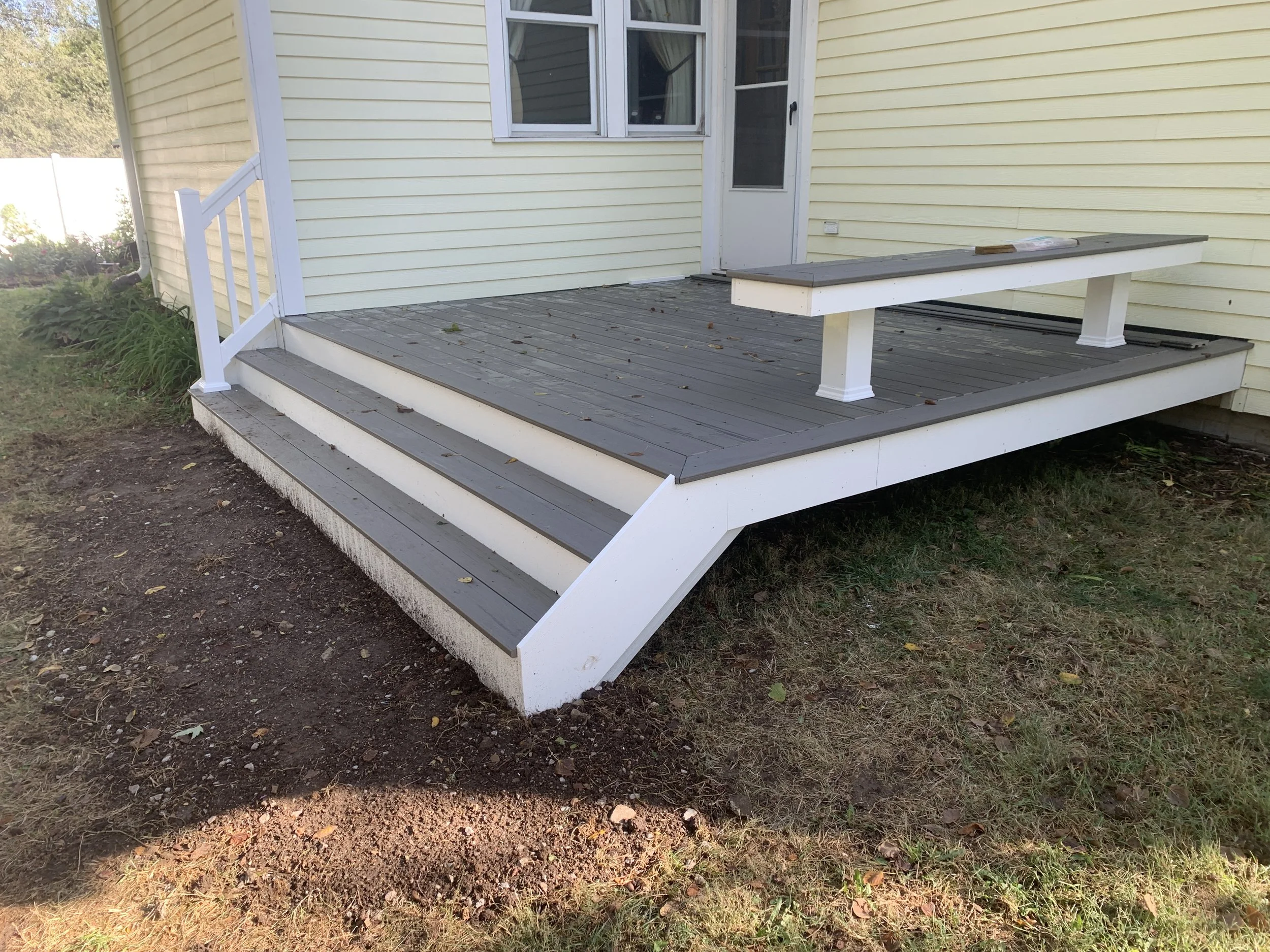 Pvc two toned composite deck with built in bench. Omaha Ne