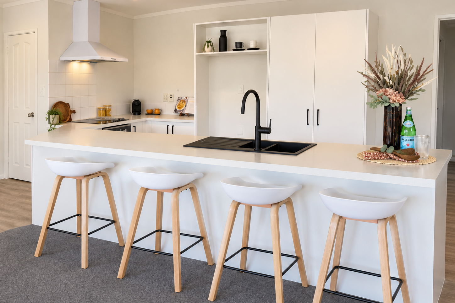 Warm+Minimalist+Kitchen+with+Four+Stools.png
