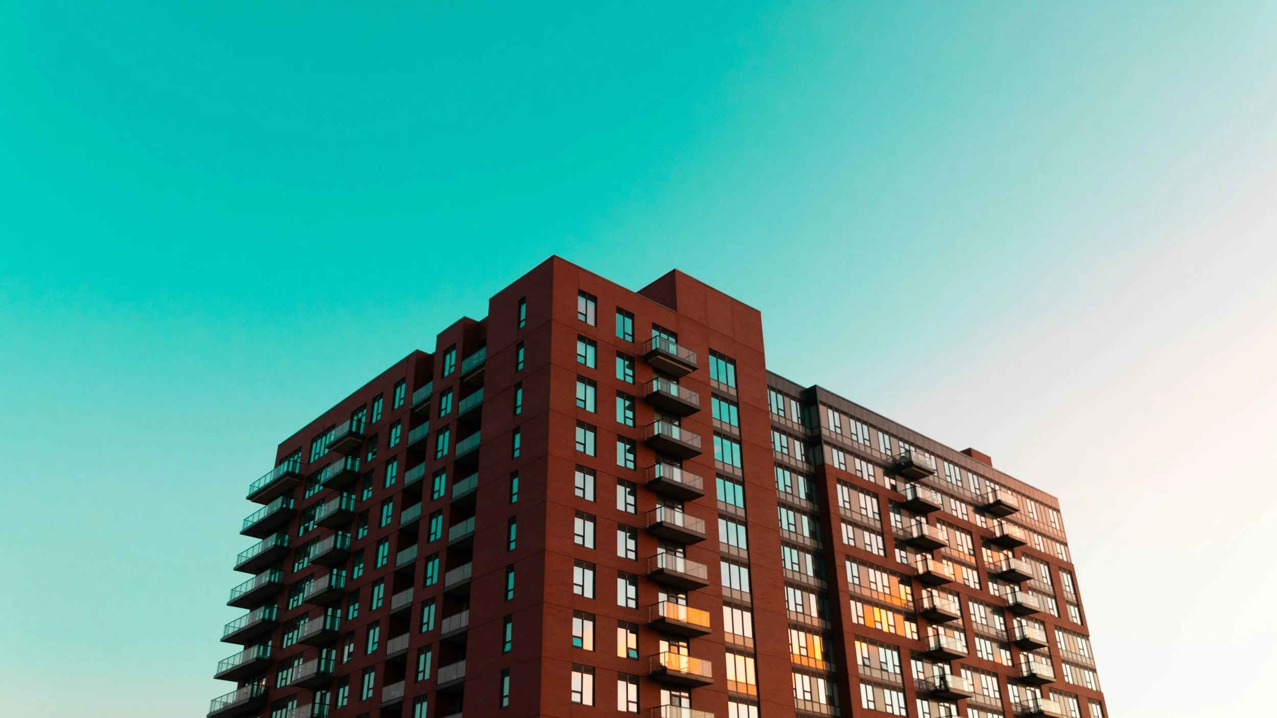 Apartment tower under a hot summer sky