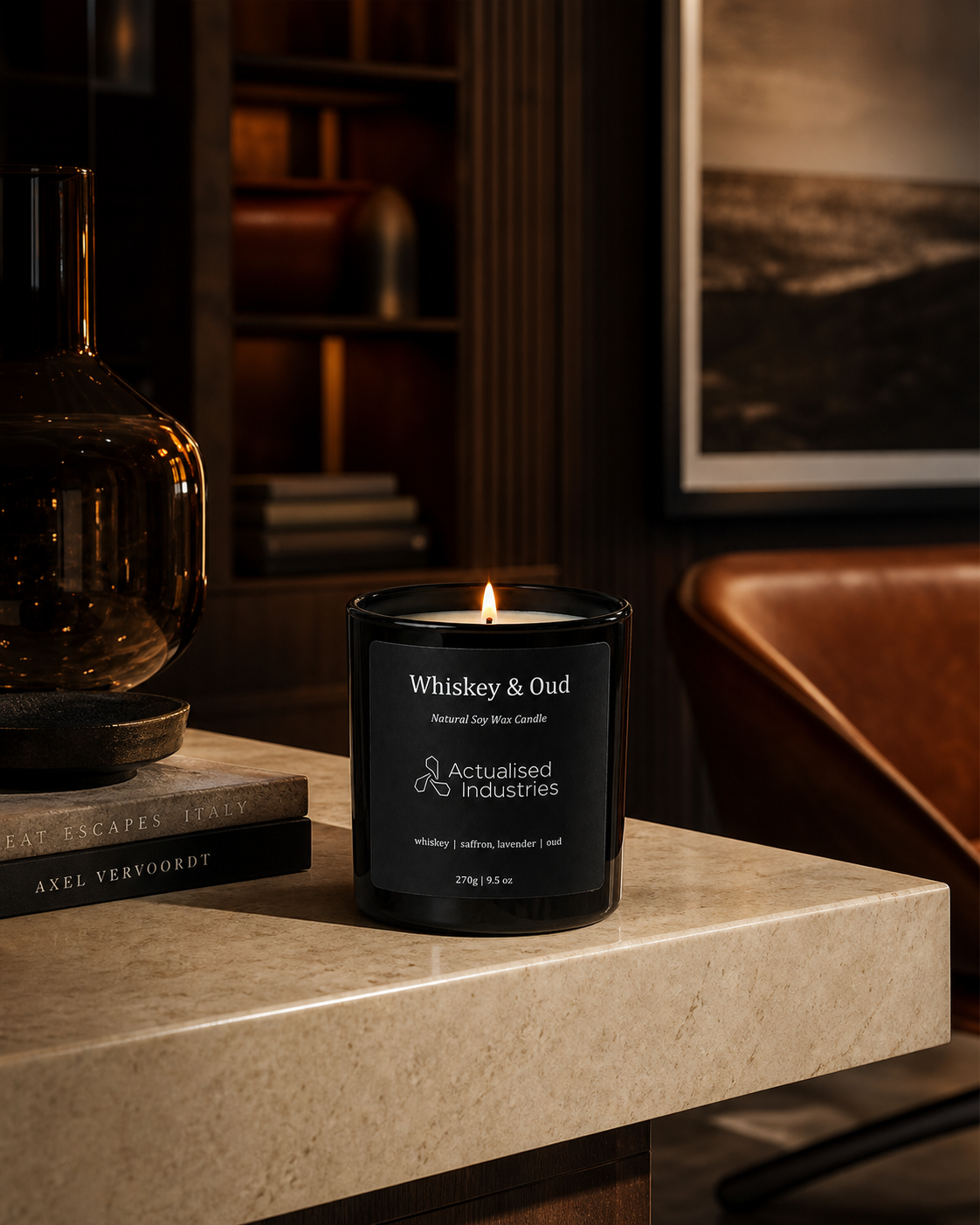 Whiskey & Oud natural soy wax candle 270g by Actualised Industries, burning on marble shelf in luxury living room with interior styling, showing premium home fragrance placement