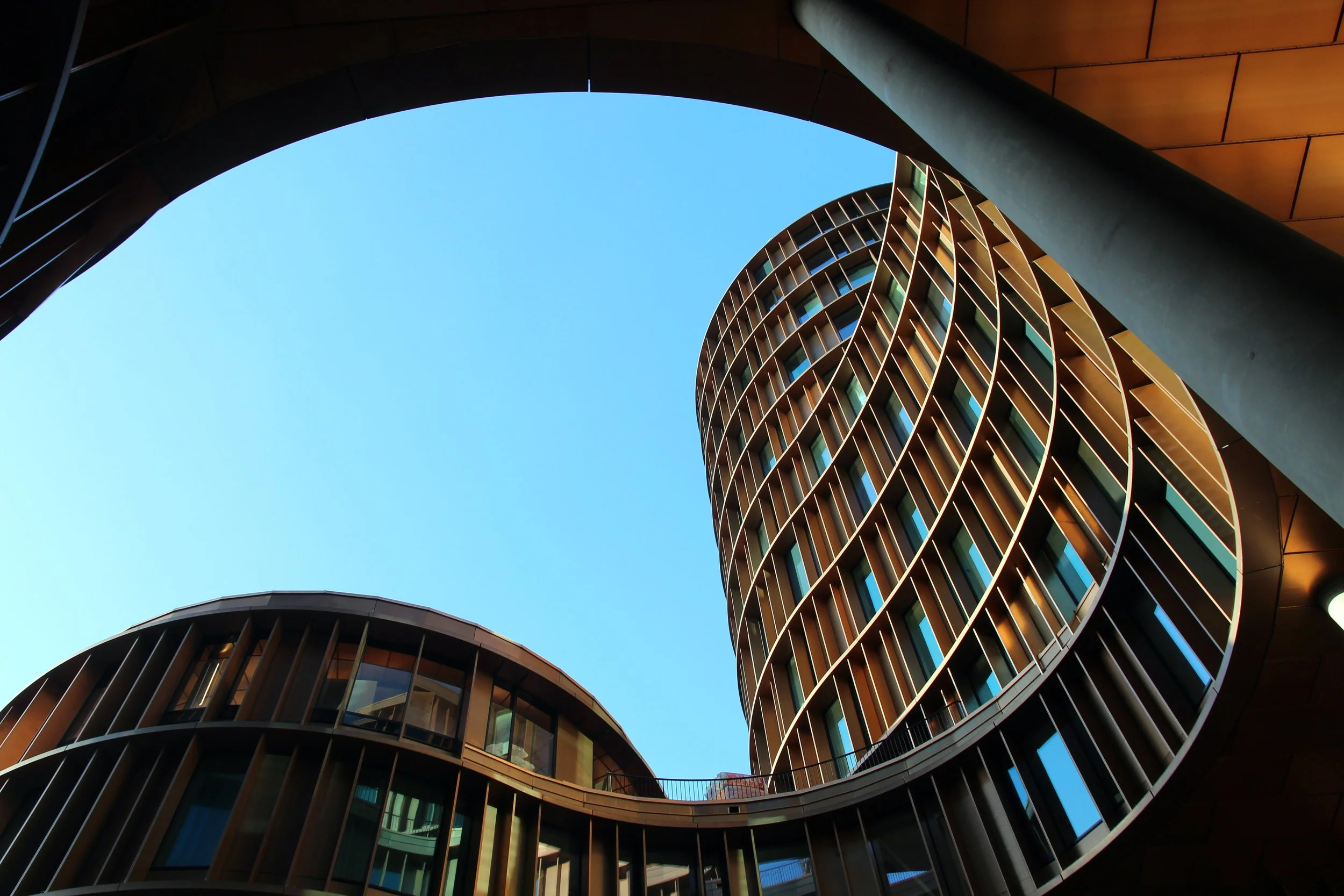 Modern apartment building exterior — odour control and air sanitation services for strata managers in Melbourne and Sydney