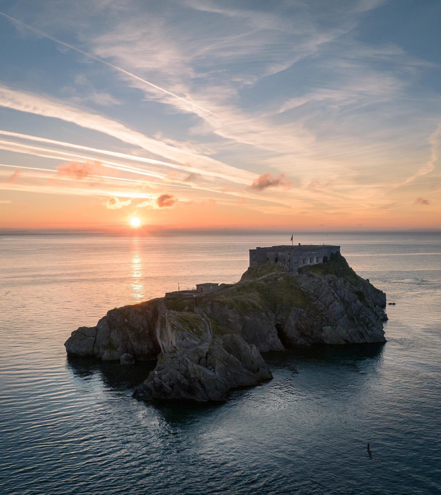 The majestic St Catherine&rsquo;s Island in Tenby looking stunning at sunrise in the late August early light. 
.
.
.
#stcatherinesisland 
#pembrokeshire 
#tenby 
#tenbybeach 
#tenbyharbour 
#visitwales 
#visitpembrokeshire 
#dji 
#djimavic3
#sunrise
