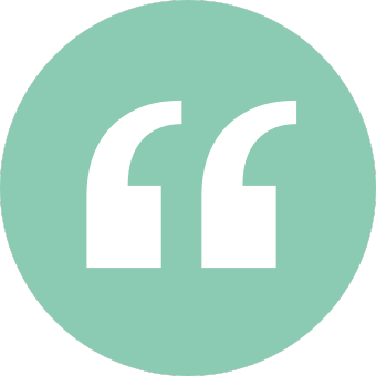 A light green circle with white quotation marks in the center.
