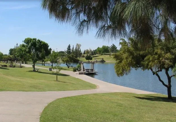 Amy Stephens stands before Kiwanis Park