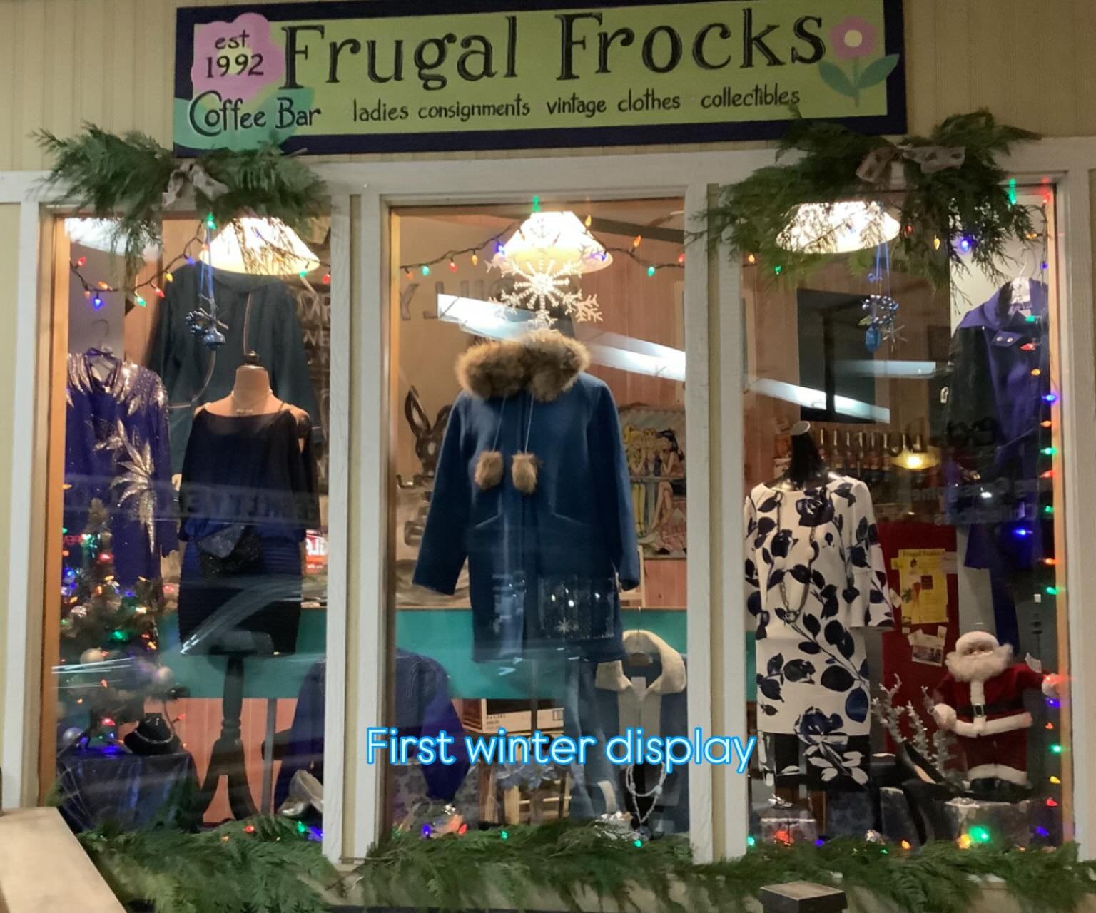 Current window display features cool blue and silver hues. Brrr, it's cold outside! Spotlight on our Yukon wool parka with wolf trim hood and optional rain cover for rainy days. Size medium, pristine condition, $195.00. Browse our cozy sweaters, coat