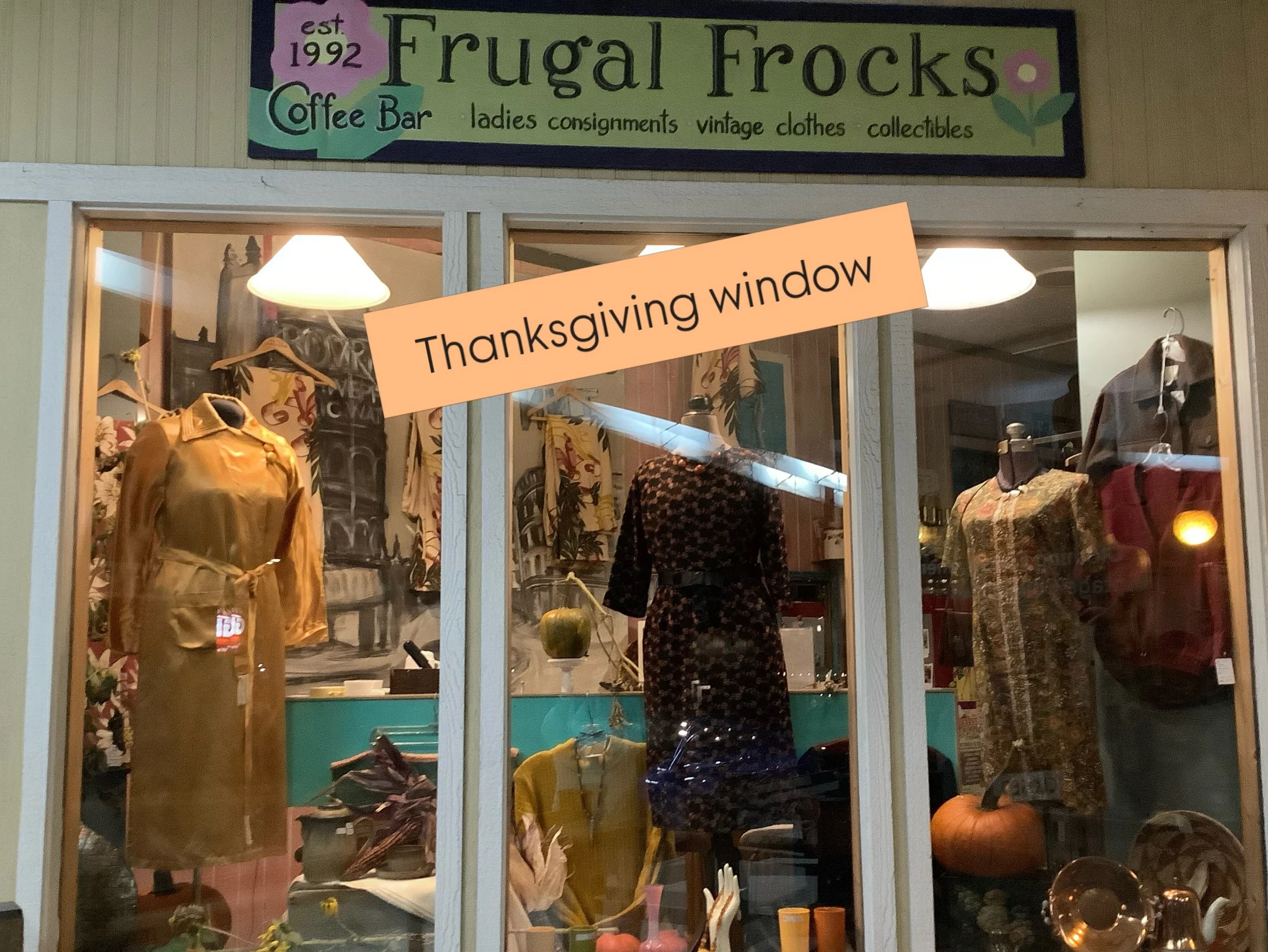 Lots of reflections from signs across the the way. Looks better upfront and personal if you are taking an evening stroll. All the mannequins feature vintage /retro pieces, not to mention the barkcloth curtains separately featured. Come check us out i
