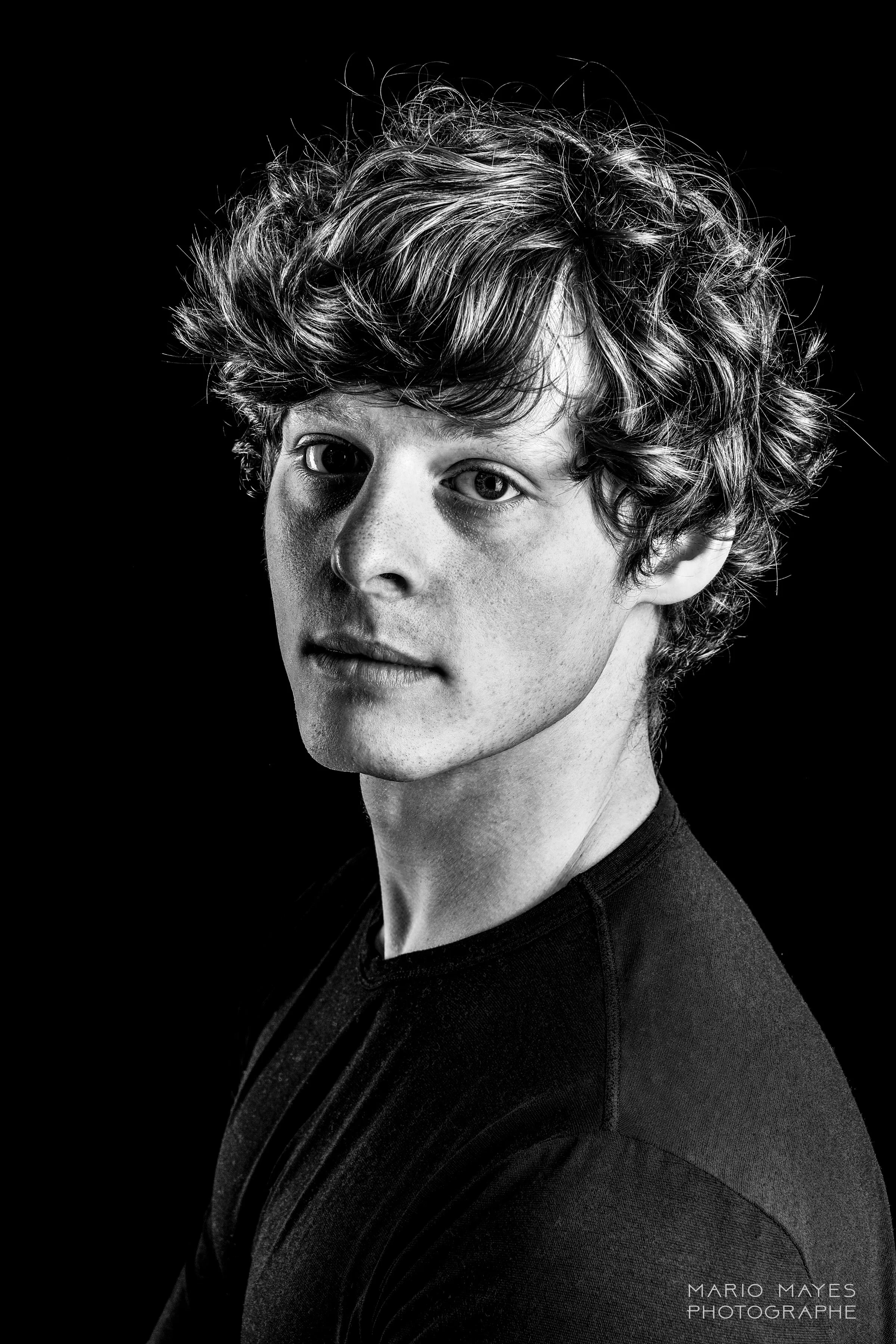 A headshot of Matthew
