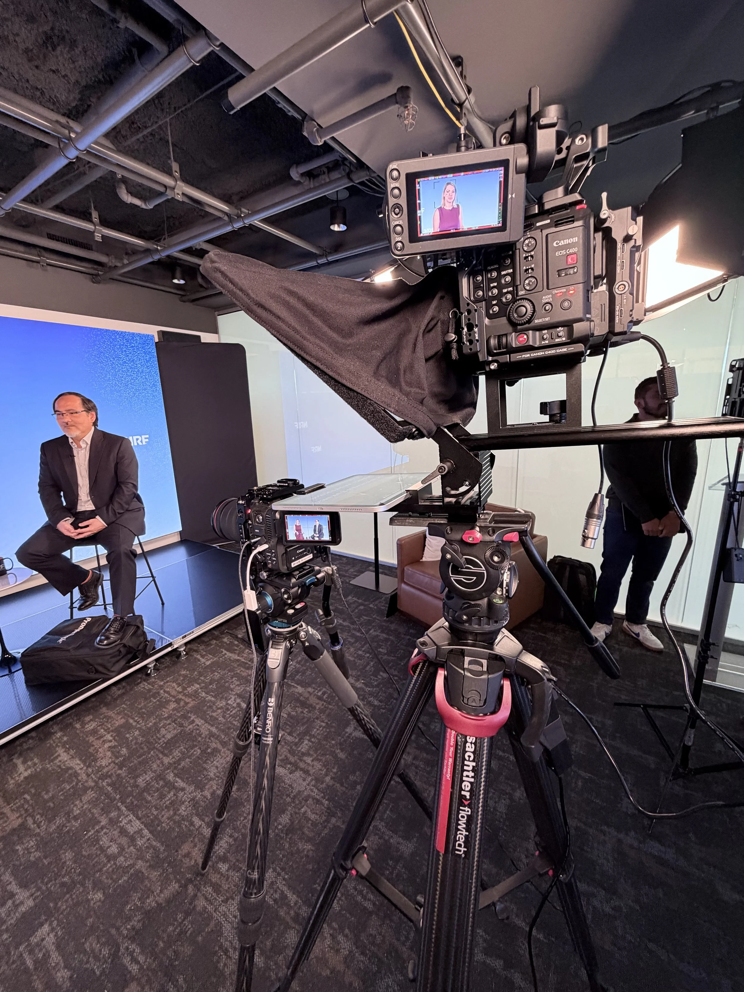 Canon C400 behind a teleprompter and a Canon C70 filming a presenter in an in-house studio in Washington, DC, by C King Media