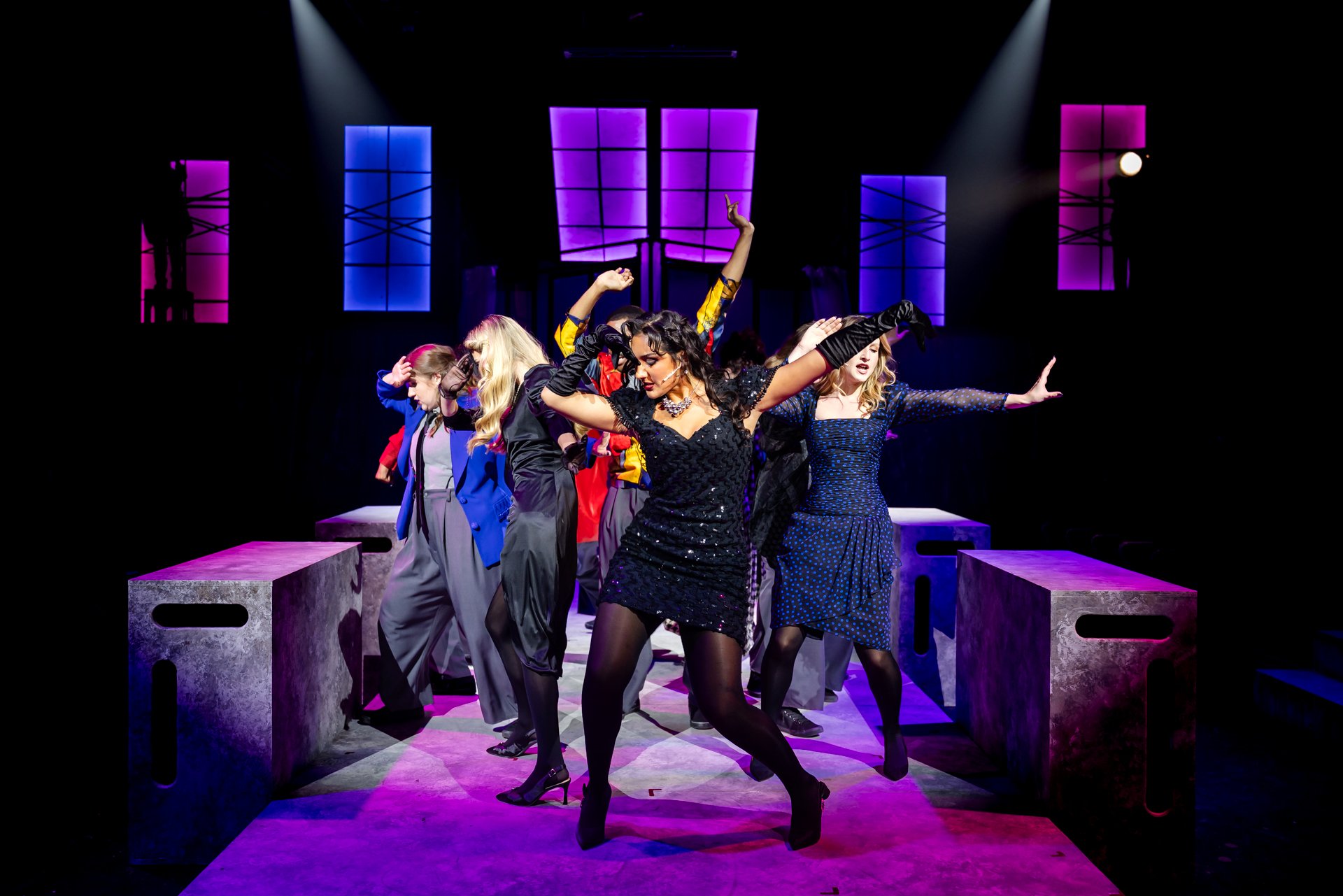 Ensemble dancing under pink and blue lights in American Psycho at Glaize Studio Theatre, Shenandoah Conservatory