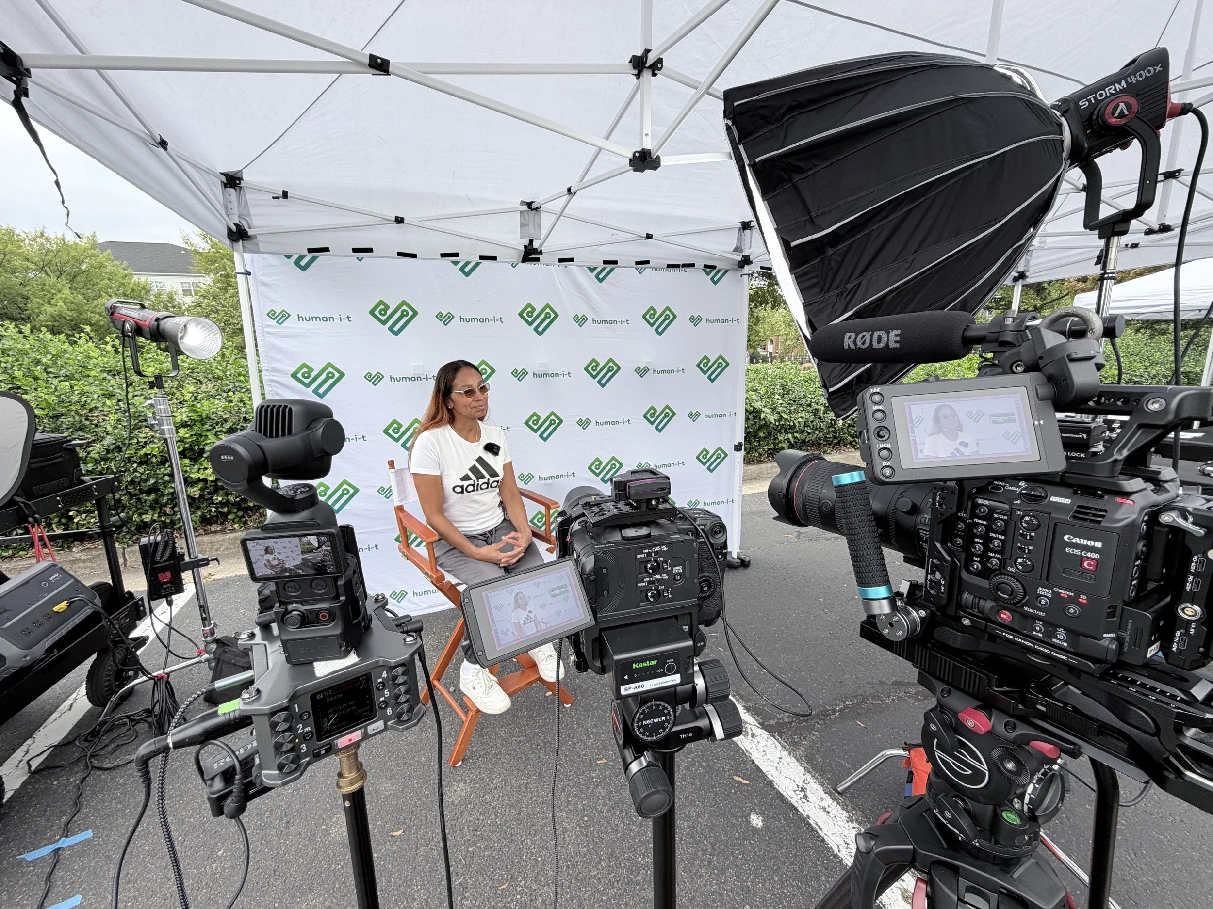 Professional testimonial interview filmed outdoors at the Human-I-T and AT&T laptop giveaway in Alexandria, Virginia by C King Media